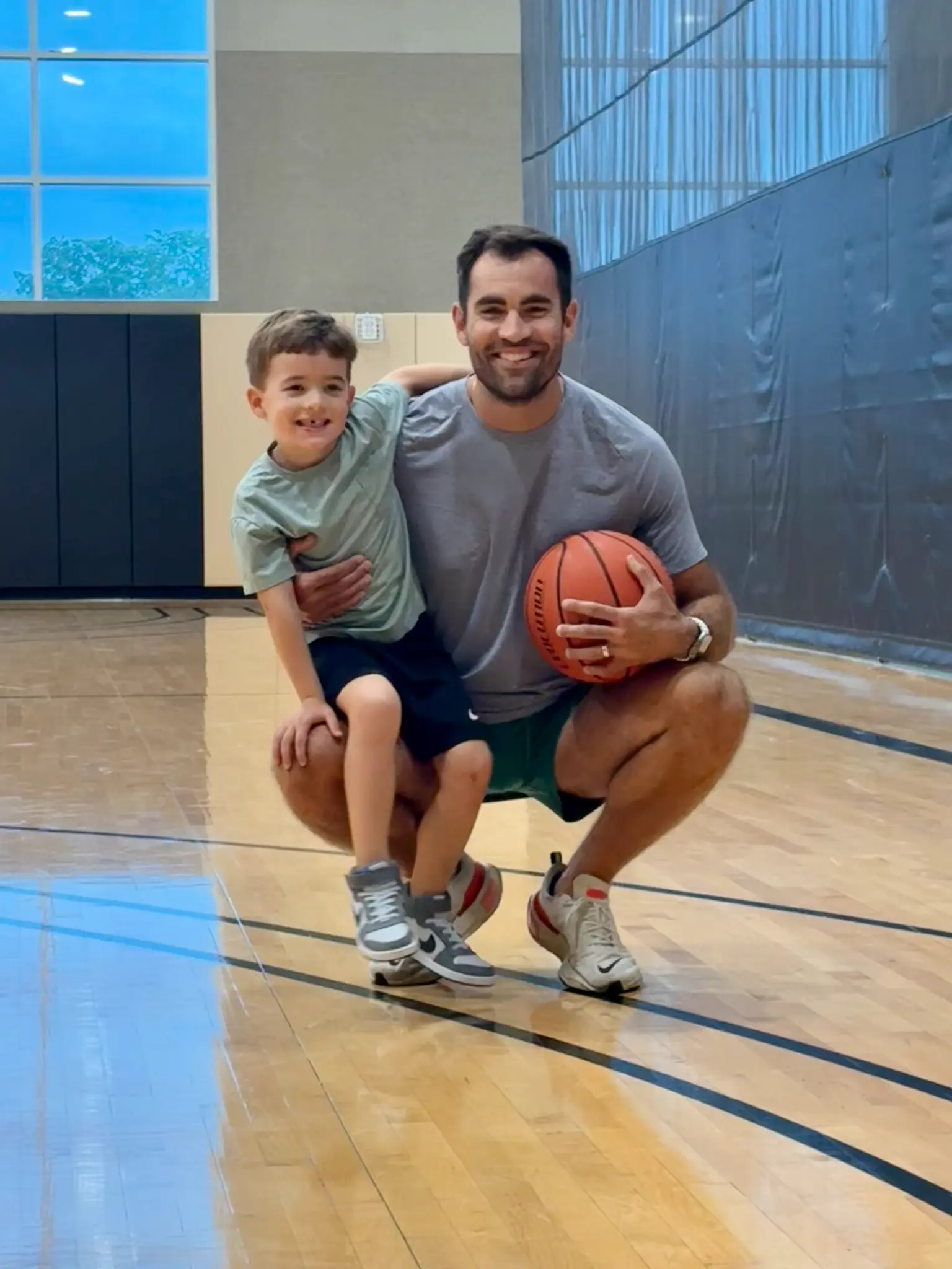 Alex Hutto with his son at basketball practice