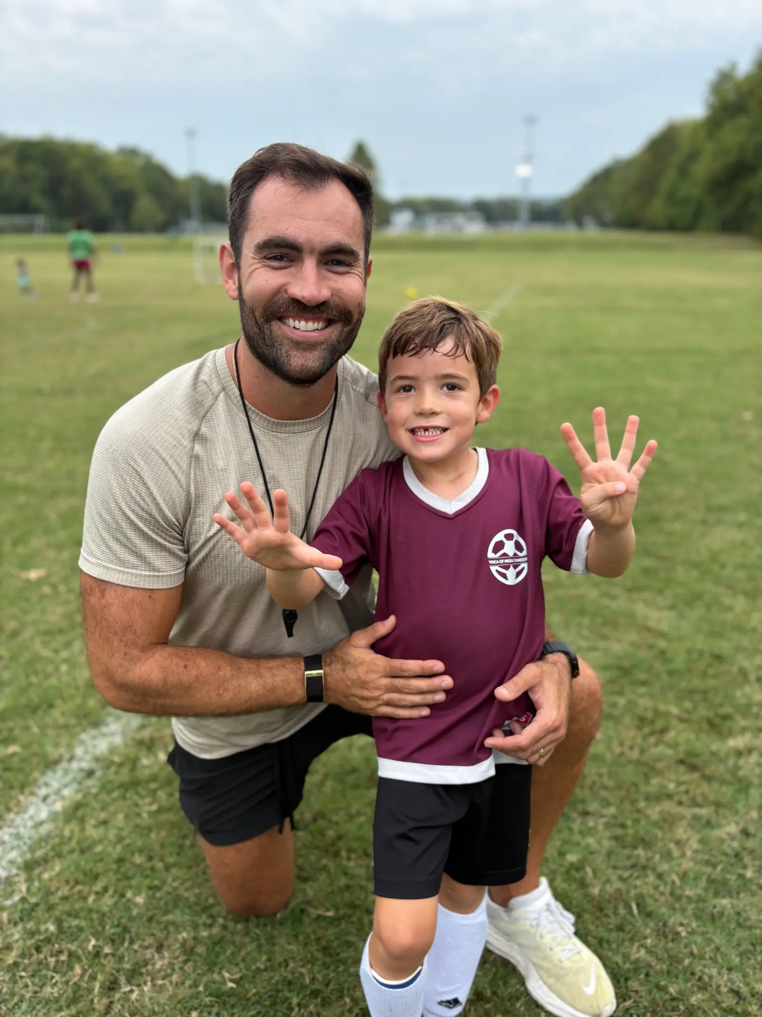 Alex Hutto with his son on the soccer field